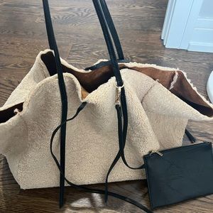 Reversible shearling and suede tote bag with black leather wallet